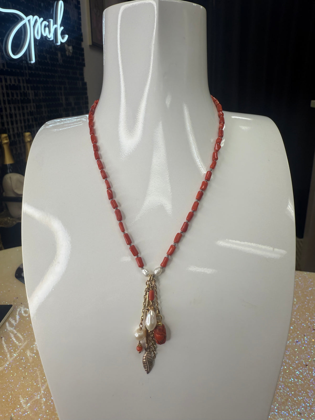 Add a splash of vibrant charm to your look with this 36" necklace featuring rich garnet coral beads and delicate semi-precious accents. Finished with playful coral drops at each end, it’s the perfect accessory to brighten any outfit with a touch of natural beauty and fun. A staple for curated boutique fashion and chic affordable style available at your Women's Boutique West Palm Beach, FL  CS106