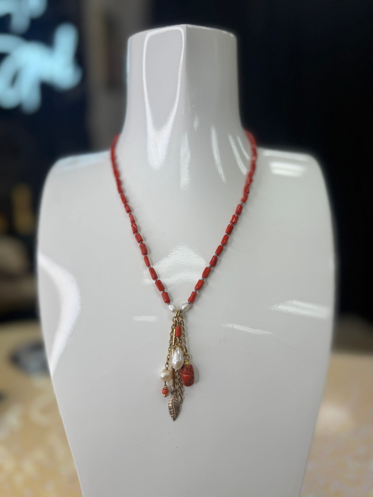 Add a splash of vibrant charm to your look with this 36" necklace featuring rich garnet coral beads and delicate semi-precious accents. Finished with playful coral drops at each end, it’s the perfect accessory to brighten any outfit with a touch of natural beauty and fun. A staple for curated boutique fashion and chic affordable style available at your Women's Boutique West Palm Beach, FL  CS106