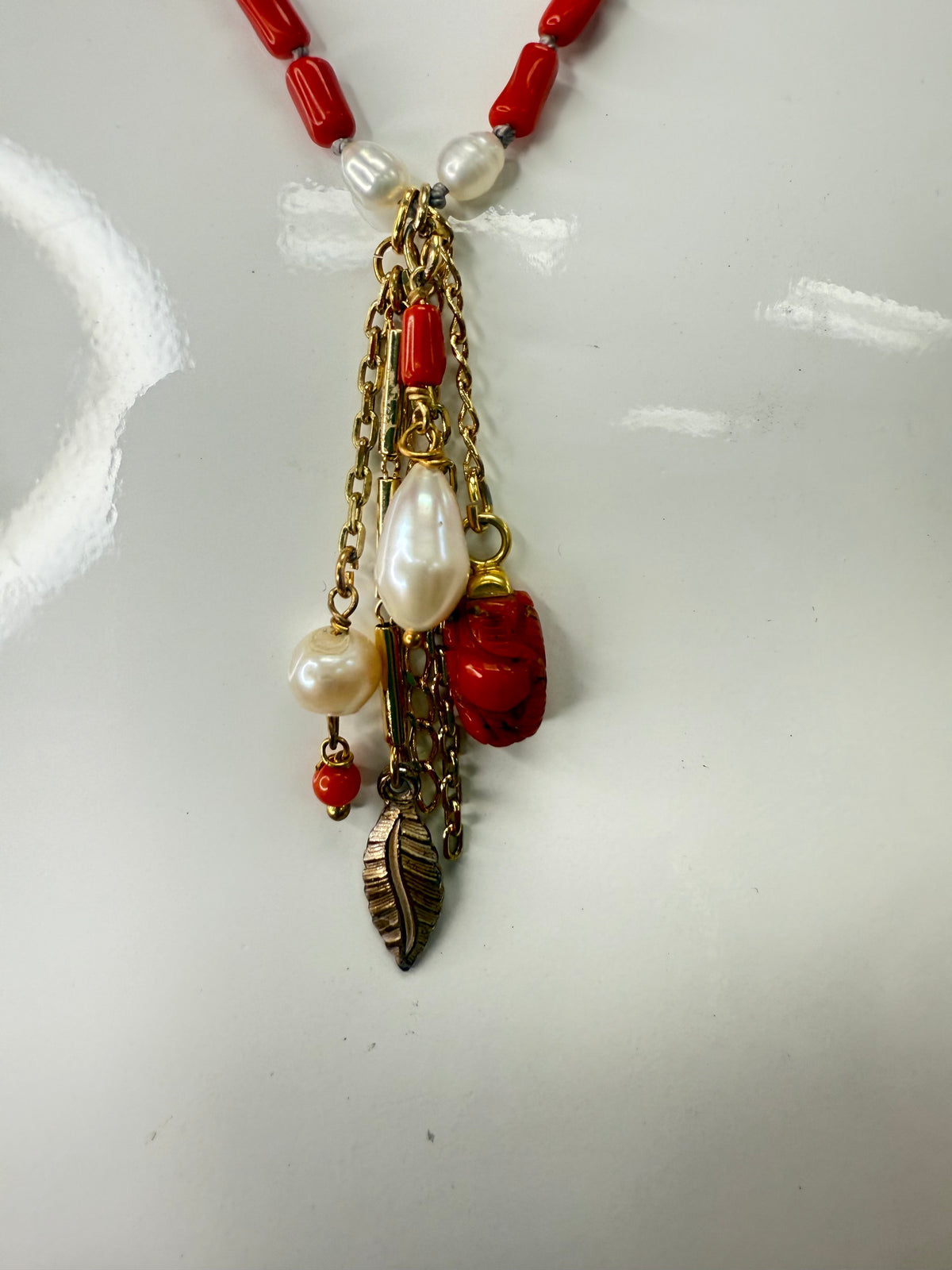 Add a splash of vibrant charm to your look with this 36" necklace featuring rich garnet coral beads and delicate semi-precious accents. Finished with playful coral drops at each end, it’s the perfect accessory to brighten any outfit with a touch of natural beauty and fun. A staple for curated boutique fashion and chic affordable style available at your Women's Boutique West Palm Beach, FL  CS106