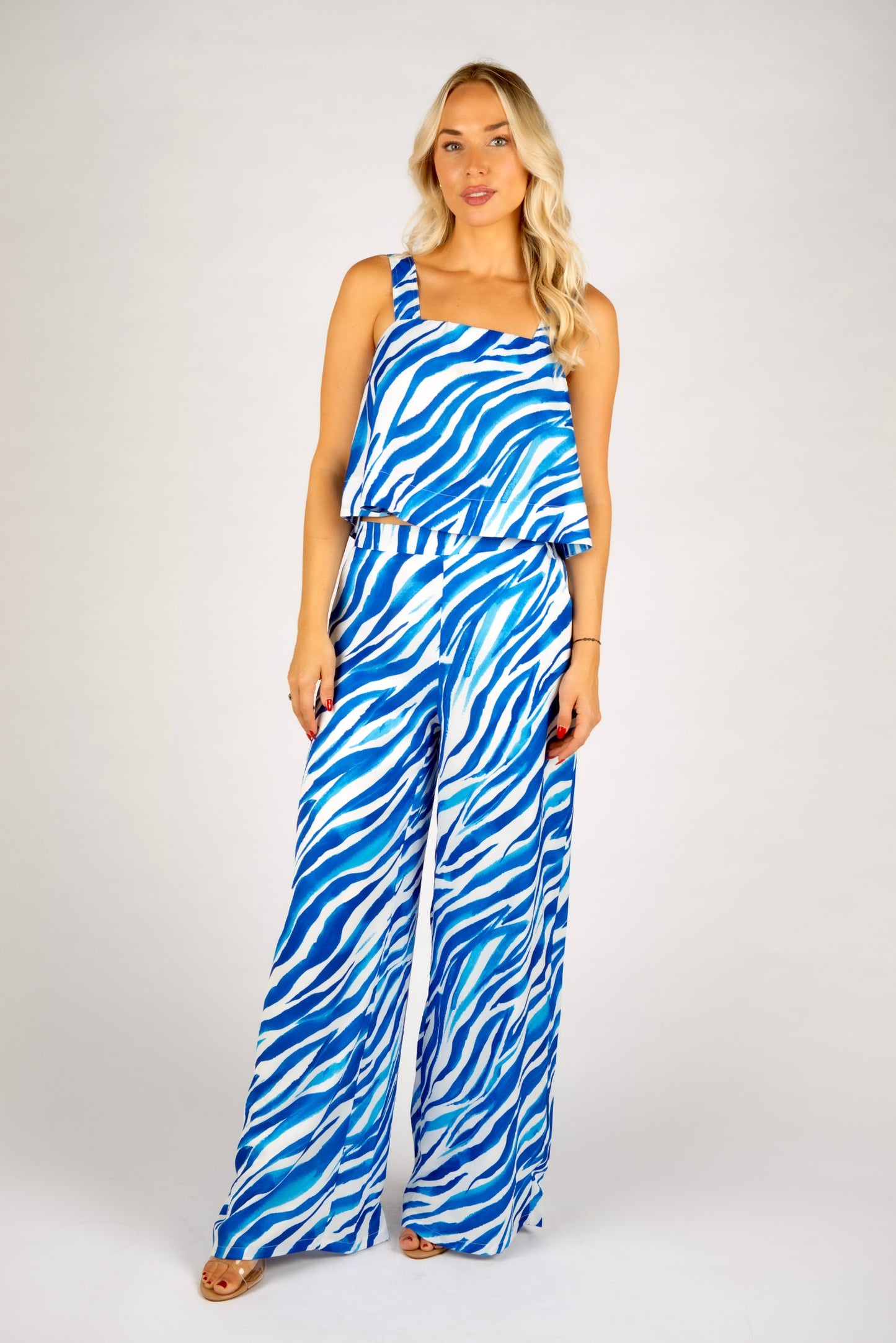 Blue zebra print crop top
One shoulder animal print top
Bold zebra print tank top
Abstract stripe summer top
Blue and white printed top
Statement crop top for women
Trendy summer going out top
Asymmetrical strap top
Eye-catching zebra pattern tank
Resort wear matching set top
Blue festival outfit idea
Strappy crop top for vacation
Vibrant animal print top
Co-ord set zebra print top
Lightweight sleeveless top for summer
