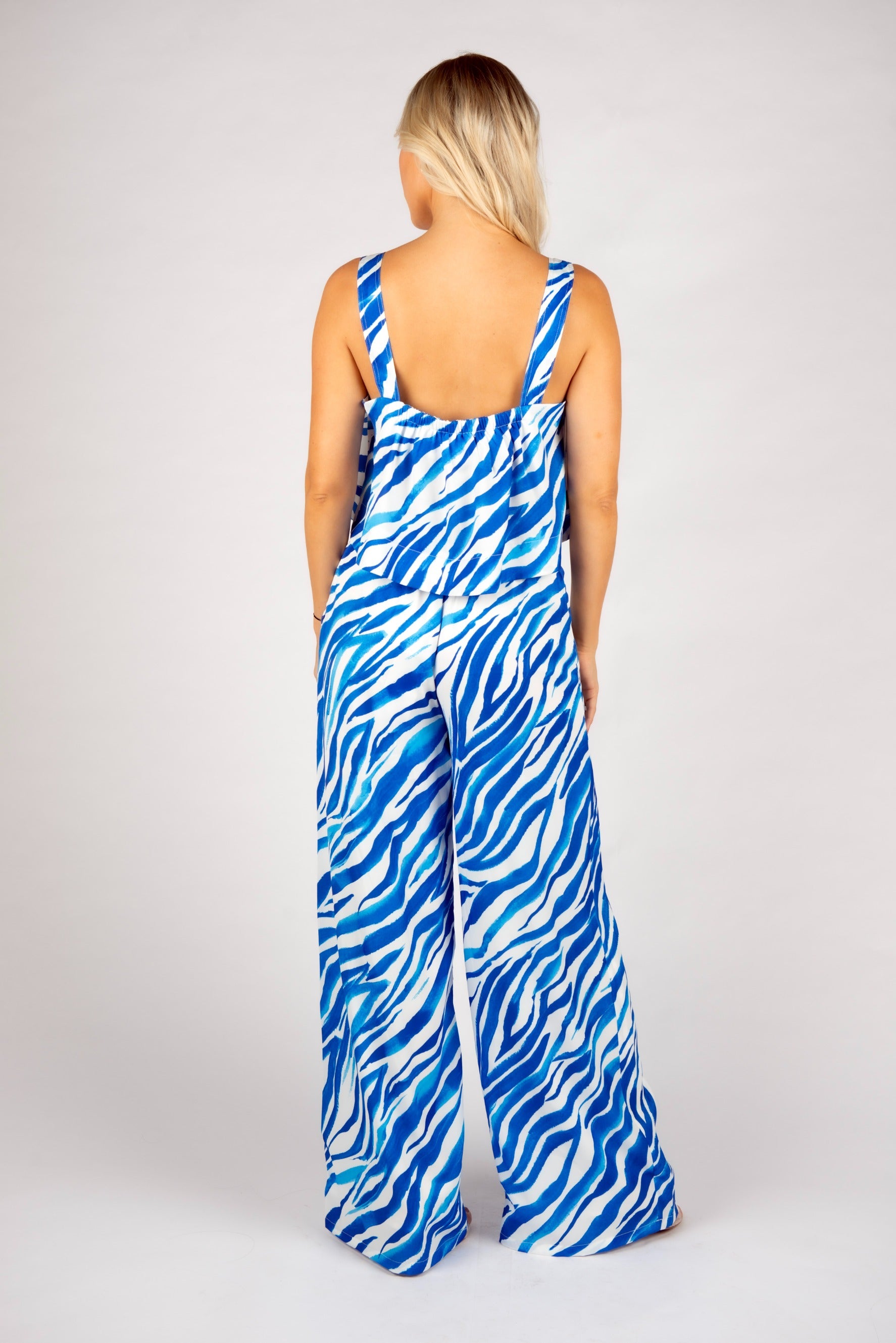 Blue zebra print crop top
One shoulder animal print top
Bold zebra print tank top
Abstract stripe summer top
Blue and white printed top
Statement crop top for women
Trendy summer going out top
Asymmetrical strap top
Eye-catching zebra pattern tank
Resort wear matching set top
Blue festival outfit idea
Strappy crop top for vacation
Vibrant animal print top
Co-ord set zebra print top
Lightweight sleeveless top for summer
