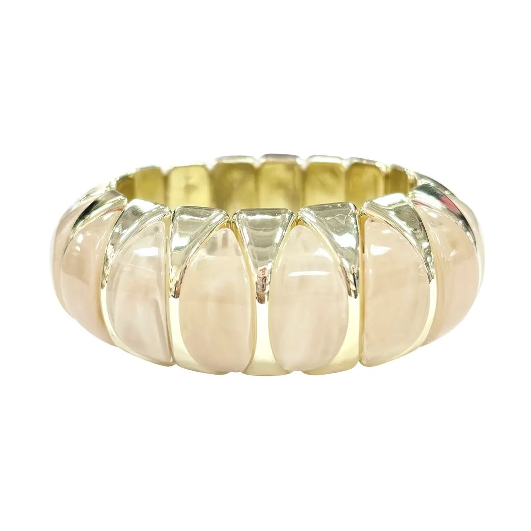 Gold and beige bracelet on a white background