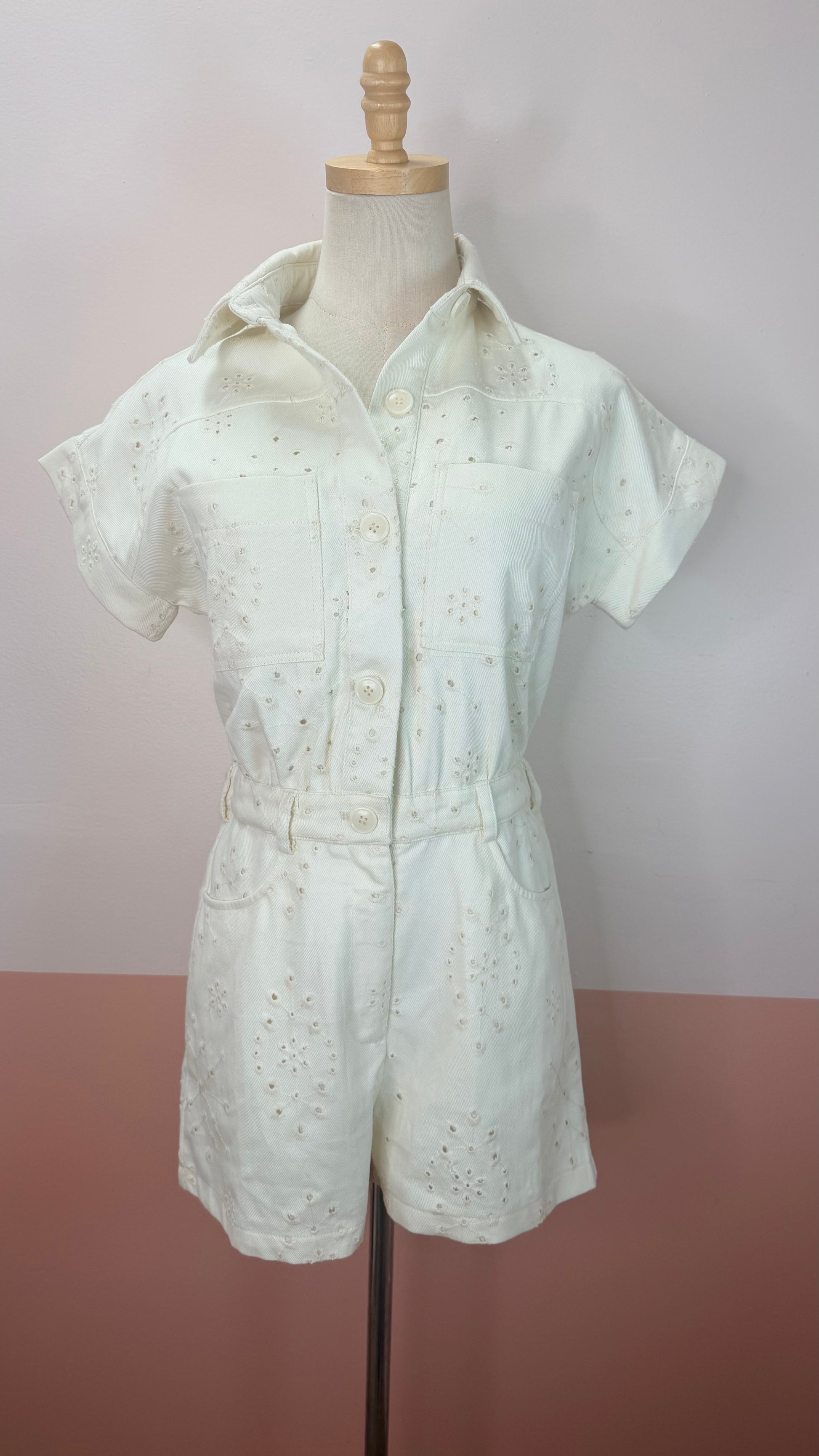 Angelique Ivory Eyelet Romper - The Spark Boutique. Angelique ivory eyelet romper with delicate cutout detailing