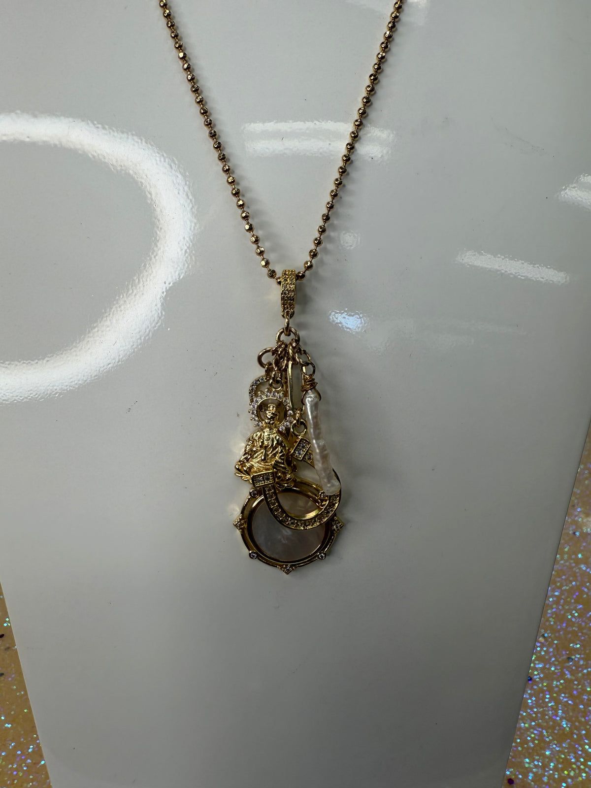 Add a touch of sparkle and fun to any outfit with this Gold Beaded Chain Necklace featuring charming accents. Its playful design combines delicate gold beads with whimsical charms, making it the perfect accessory to brighten your day and spark conversations wherever you go. A staple for curated boutique fashion and hic affordable style available at your Women's Boutique West Palm Beach, FL

CS100