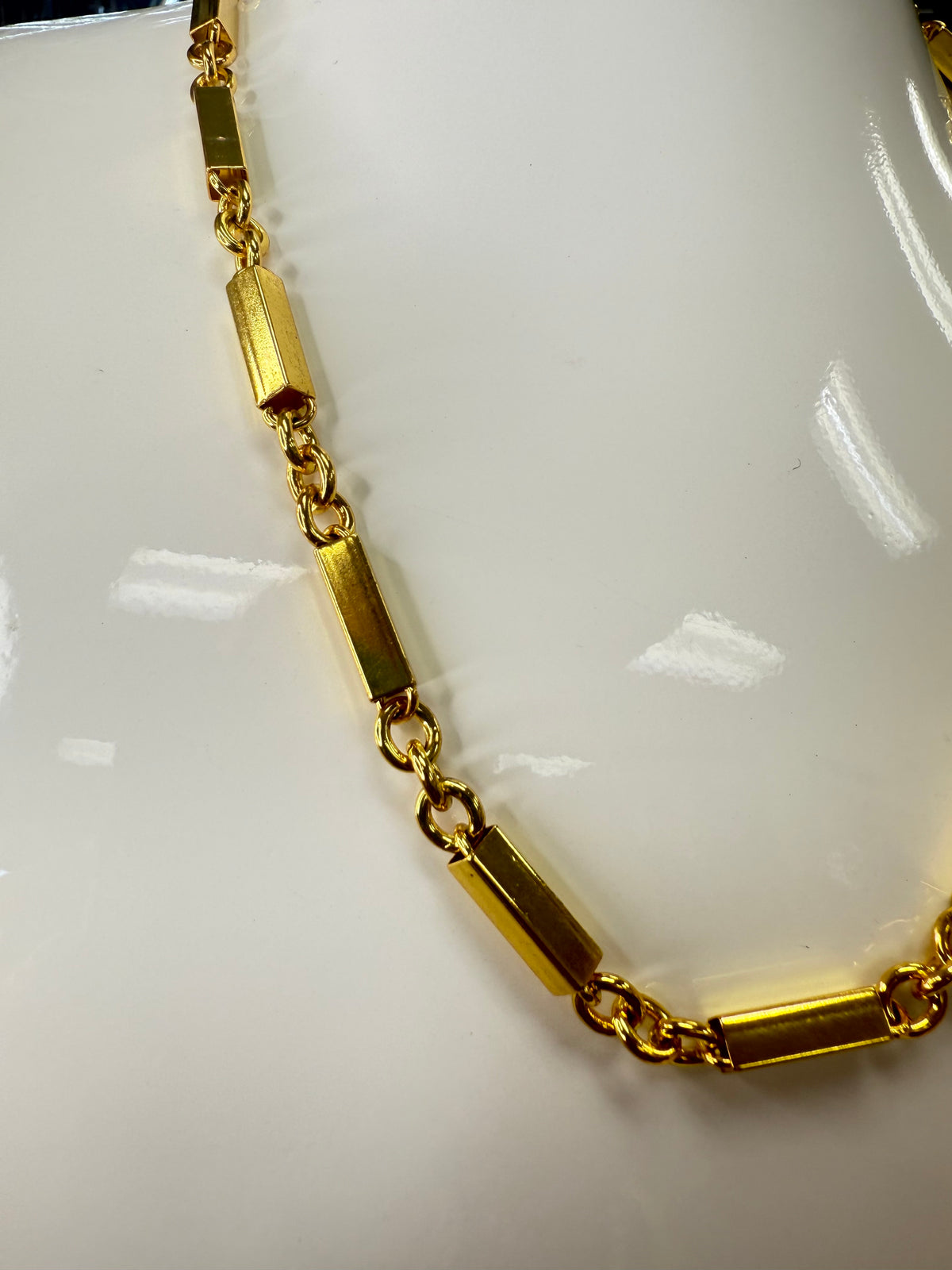 Add a touch of sparkle to your look with this Gold Tube Choker! Its sleek, shiny design hugs your neck perfectly, making it the ultimate playful accessory for any outfit. Whether you're dressing up or keeping it casual, this choker brings a fun and flirty vibe that’s sure to turn heads.  A staple for curated boutique fashion and chic affordable style available at your Women's Boutique West Palm Beach, FL