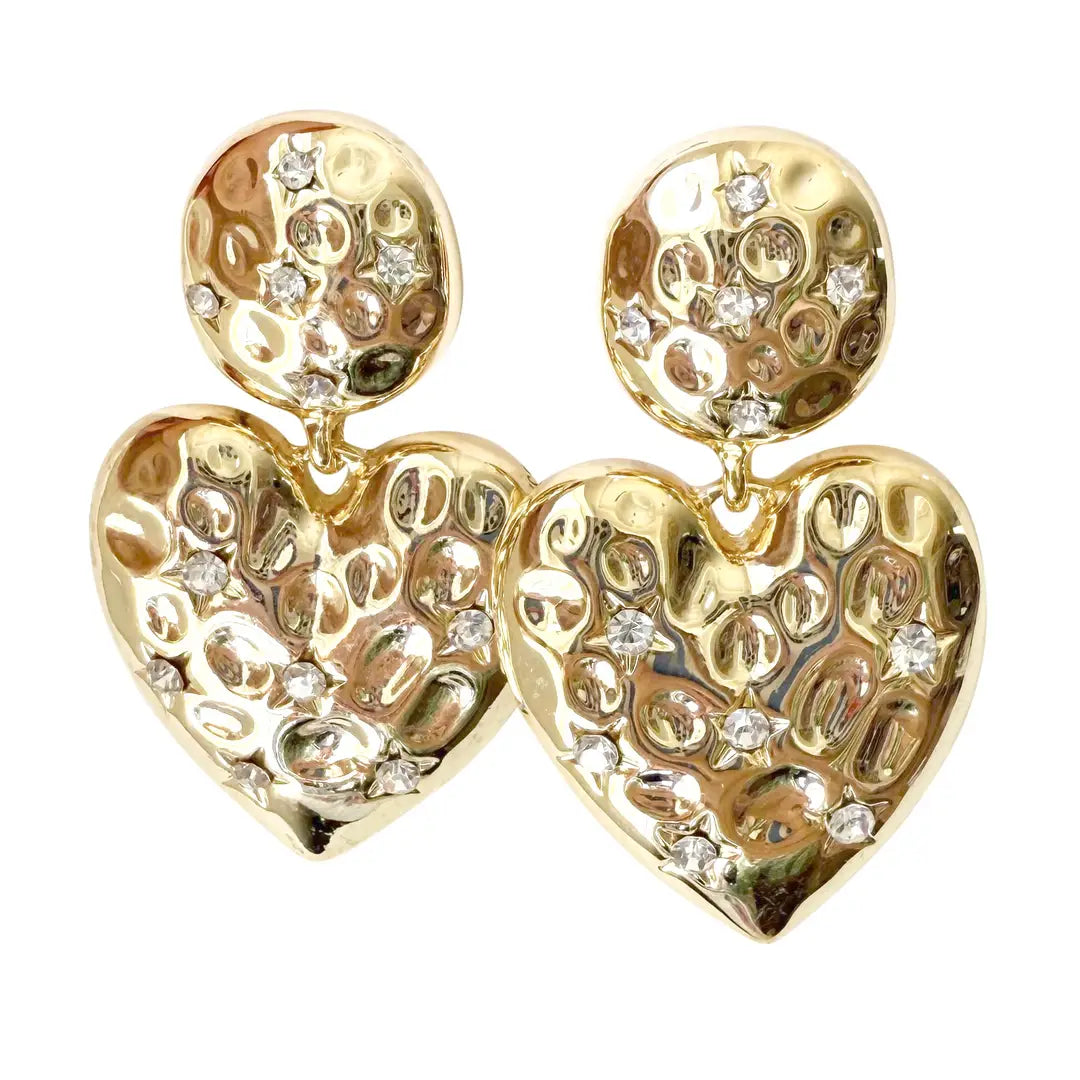 Gold heart-shaped earrings with intricate designs on a white background