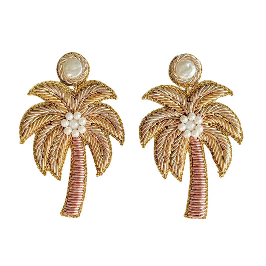 Gold palm tree earrings with pearl-like beads on a white background. West Palm Beach, Florida The Spark Boutique