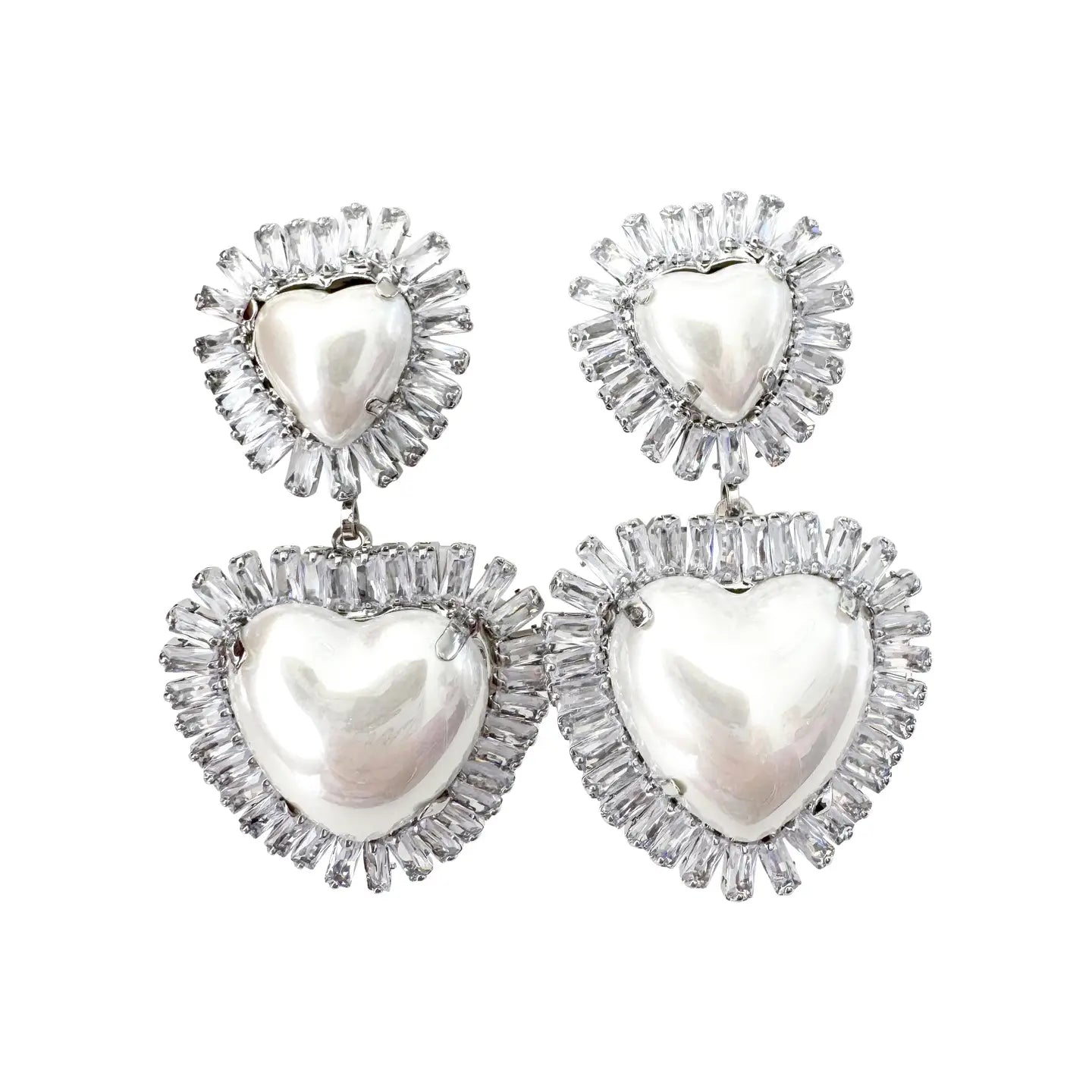 Heart-shaped earrings with pearl centers and diamond-like accents on a white background