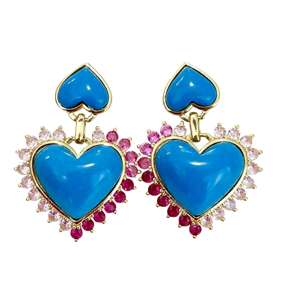 Heart-shaped earrings with blue stones and gemstone accents on a white background
