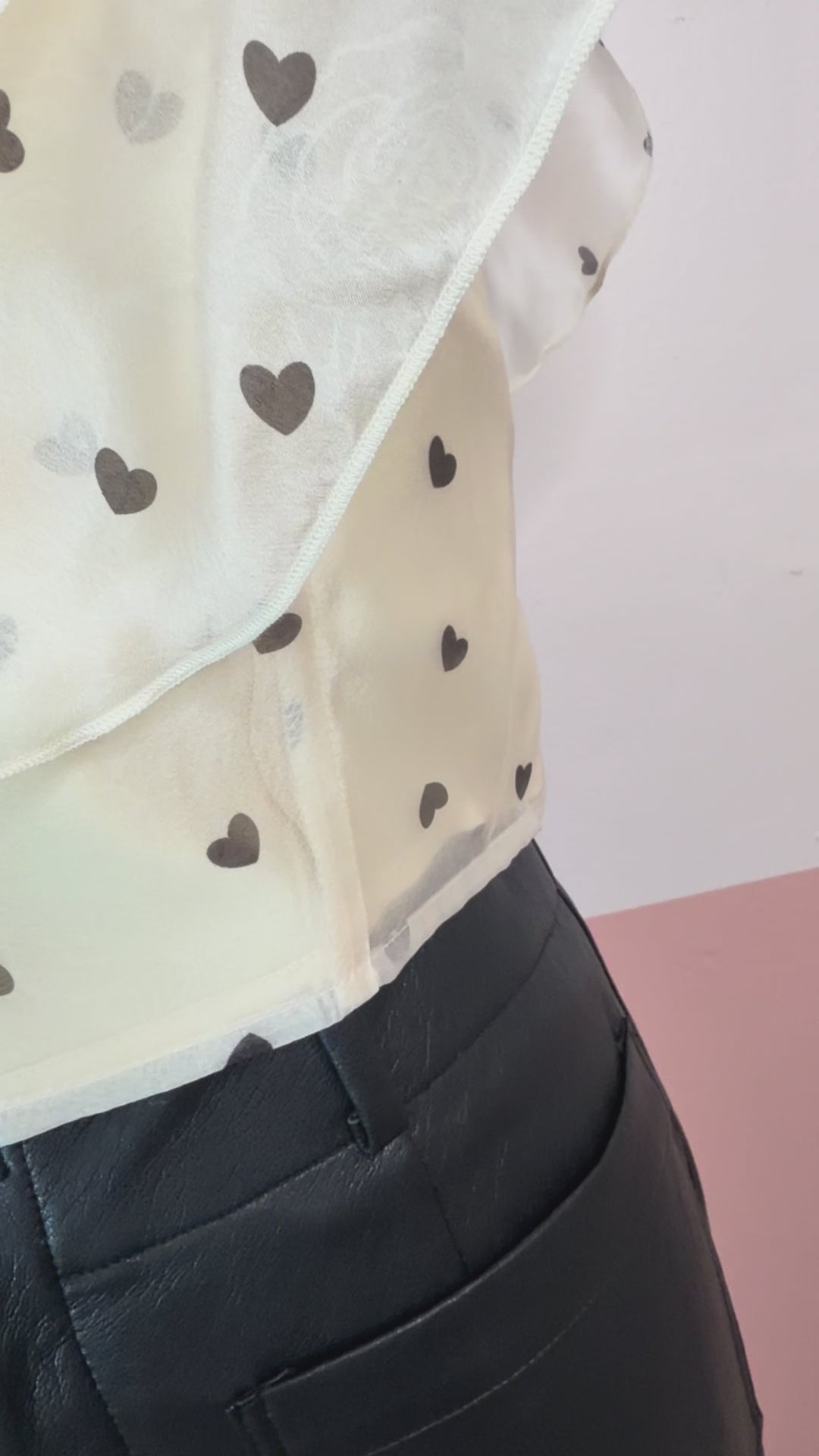 Gia Ruffle Heart Printed Top - The Spark Boutique Gia ruffle top with heart print pattern and delicate ruffle details, close up